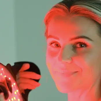 Woman putting on mask
