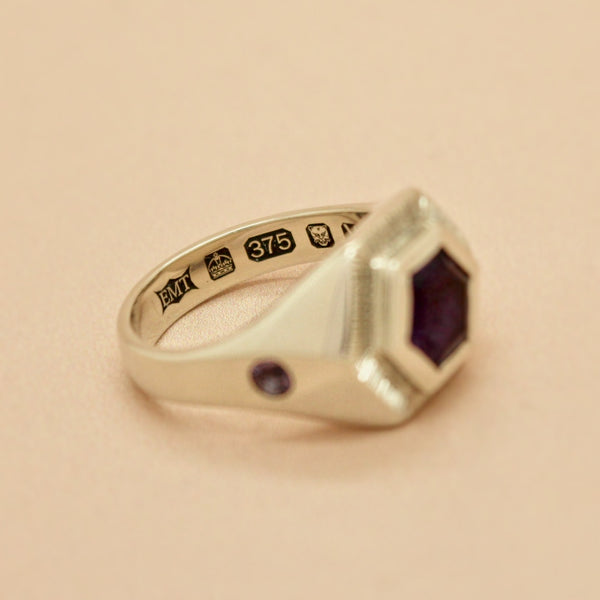 white gold amethyst hexagon signet with large London assay office hallmark stamps inside the band