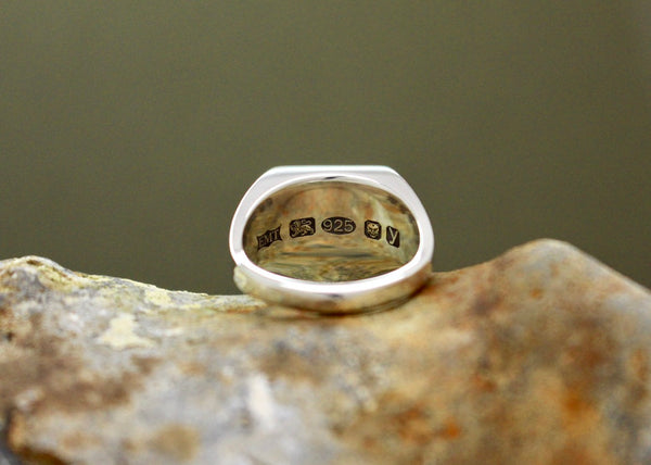large london assay office hallmark stamps on the inside of the silver wedding ring