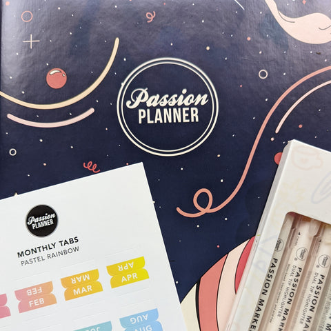 Passion Planner with markers and month tabs
