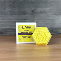 A yellow, hexagonal bar next to a box that says: Recover Bee Shampoo