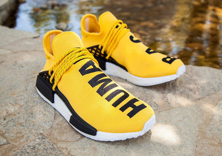nmd human race black yellow laces
