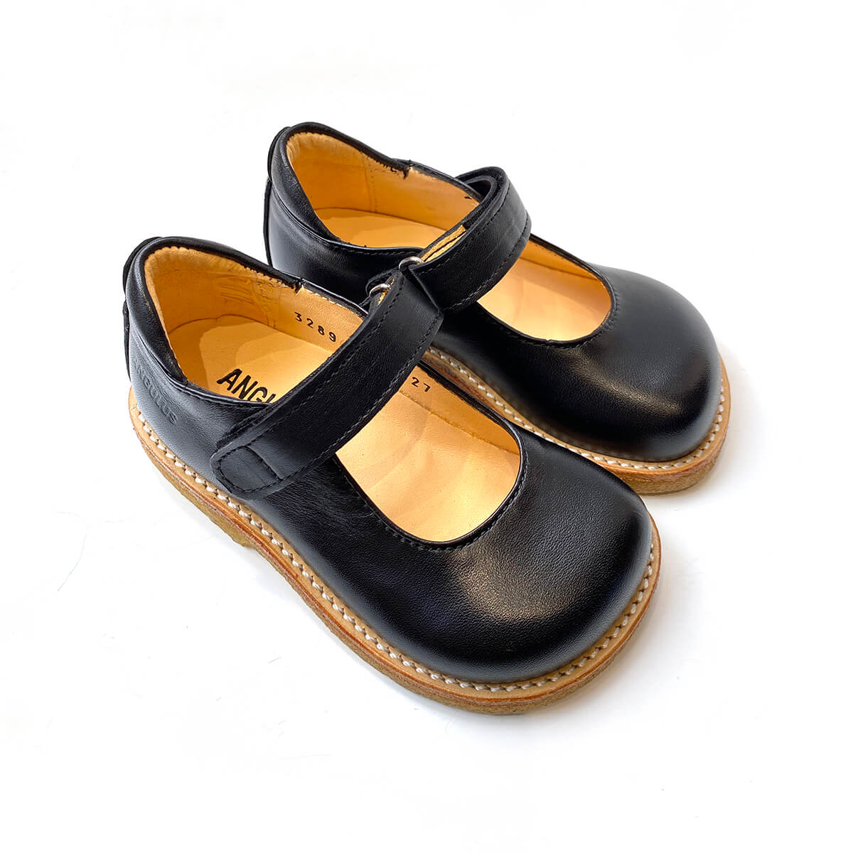 T Bar Mary Janes in Black by Angulus 