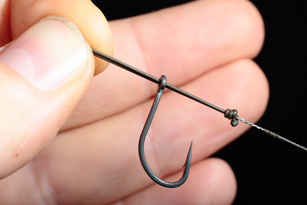 Holding the Chod hook secureley Push the loop through the eye from front to back
