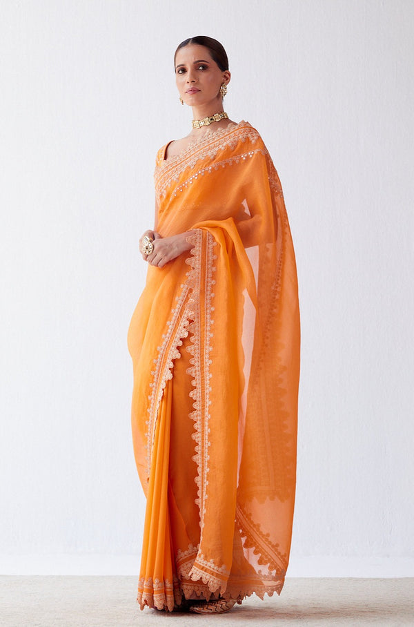 FIERY ORANGE TIE AND DYE 'ABLA' WORK CLASSIC SAREE PAIRED WITH A RED  EMBROIDERED BLOUSE AND SILVER HIGHLIGHTS. - Seasons India