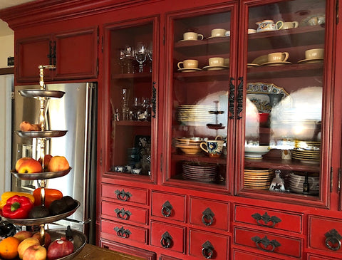 hand made custom kitchen with drawers and antique spanish hardware in red lacquer