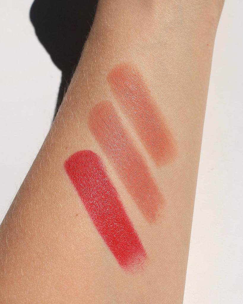 arm swatches of three lipsticks