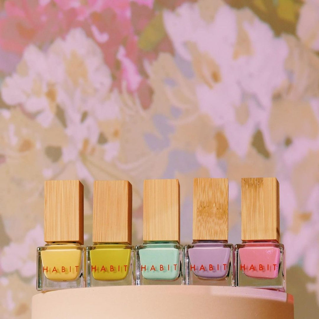 5 nail polishes in bright, spring and summer colors. They have a wooden bamboo overcap. These are Habit Cosmetics nail polishes, new 2021 spring and summer colors.
