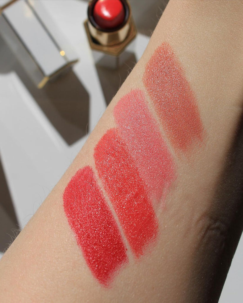 saint cosmetics velvet lip creme, matte lipsticks hand swatches. From top to bottom are Barcelona - a creamy nude, Dubai - soft pink, Singapore - orange red, and New York - classic red. Very pigmented and long wearing.