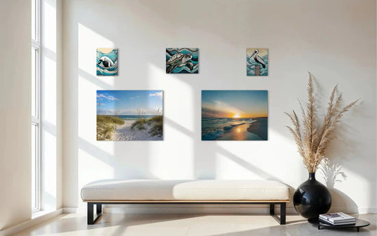 Coastal Feng Shui gallery wall with sea turtle, dunes, sunset, pelican and manatee prints balancing color and energy