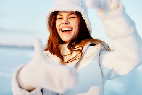 Woman wearing winter clothes and smiling