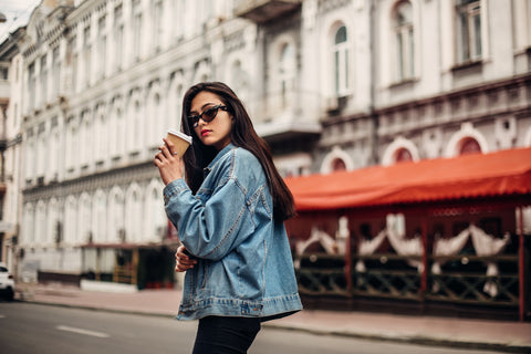 Woman looking cool and stylish while wearing a denim jacket