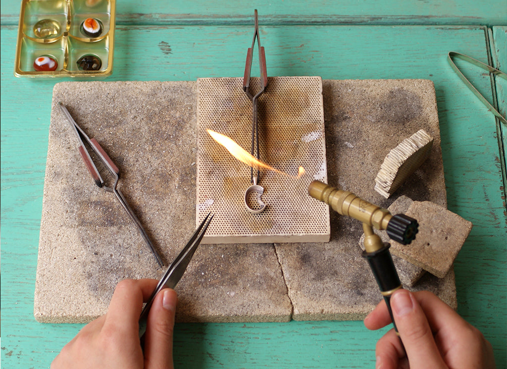 At the bench, creating jewellery Isla Gilham