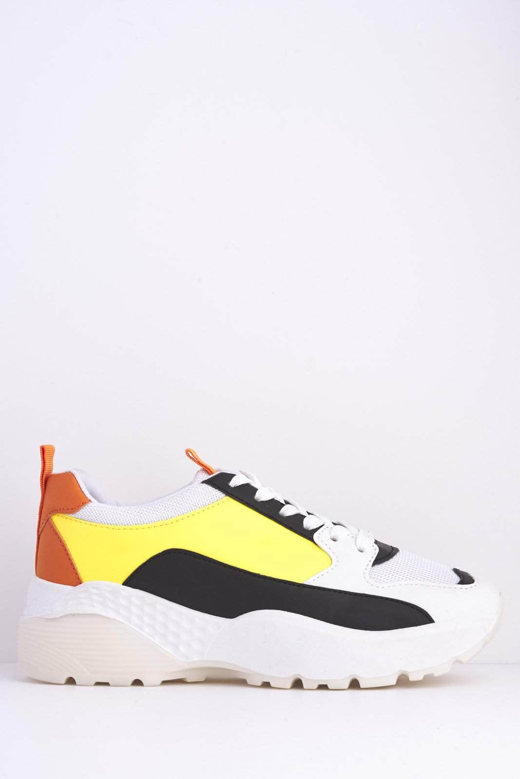 white and yellow trainers