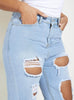 Light Wash Denim Mom Jeans with Heavy Distressed Detailing