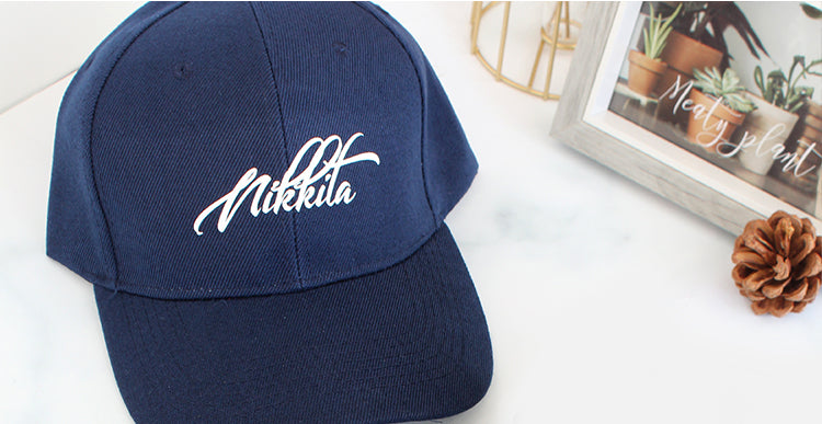 Close-up of Personalized Custom Baseball Caps in Navy Blue