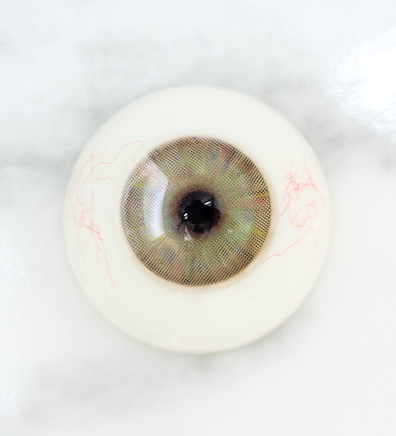 Close up of multi-tone design of Uris Chameleon Contacts in Brown on light eyes(after)