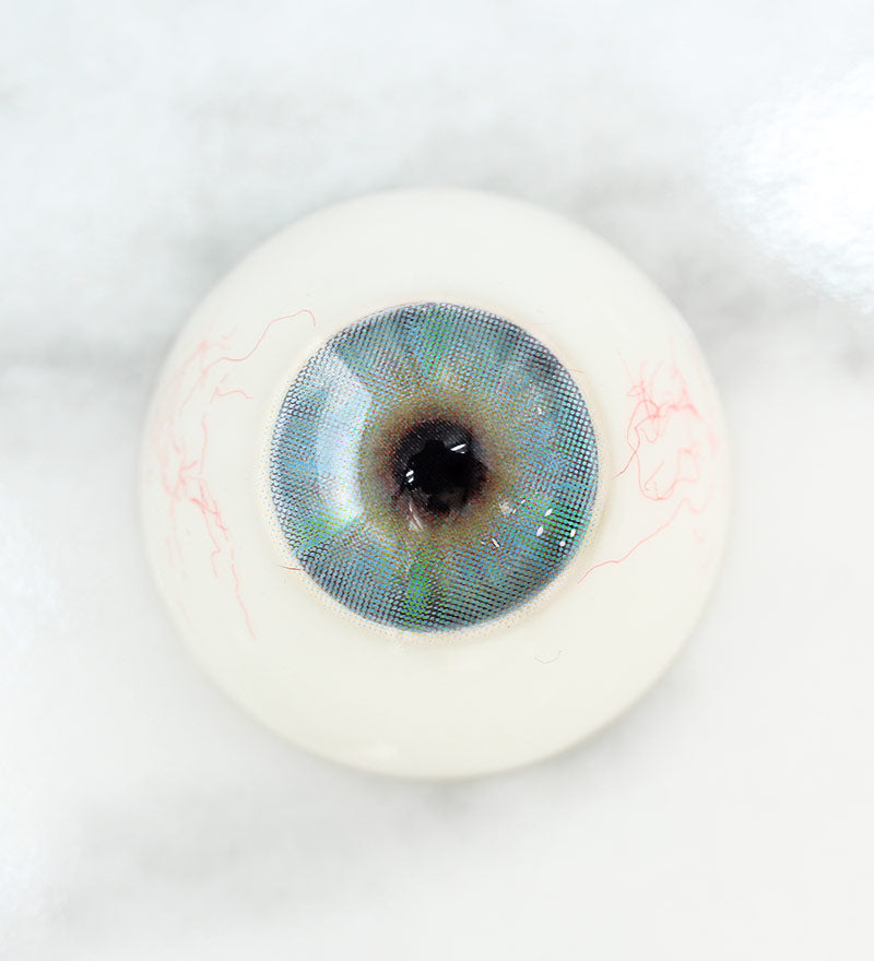 Close up of multi-tone design of Uris Chameleon Contacts in Grey on light eyes(after)