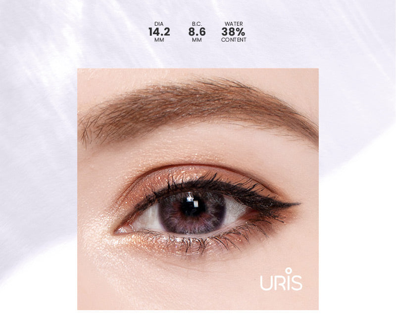 Model wearing uris genetic blue colored contacts close up