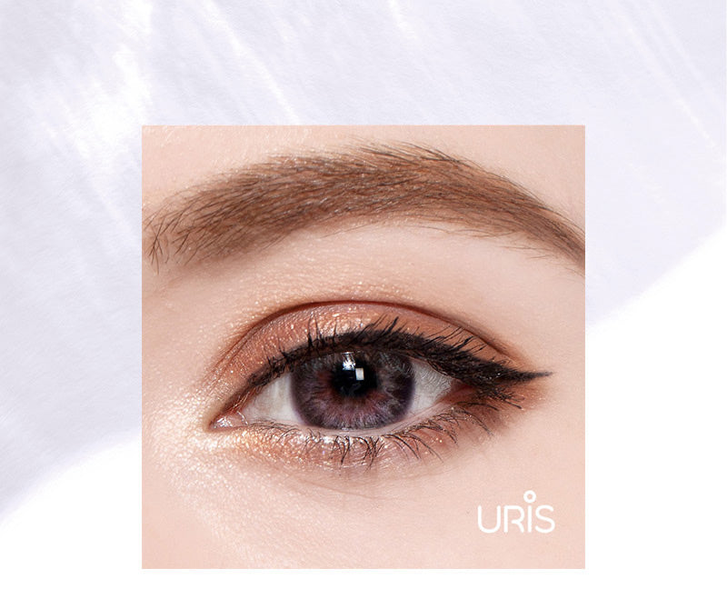 Model wearing uris genetic blue colored contacts close up