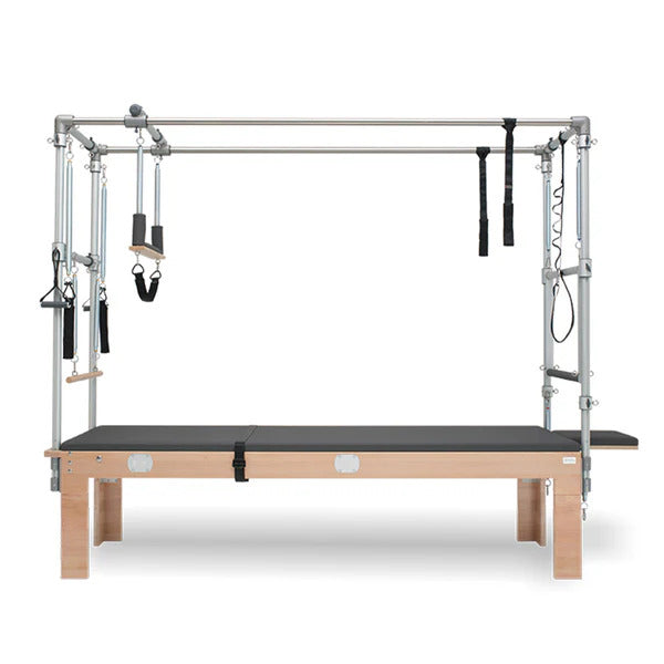 BASI Systems Cadillac Trapeze Table with adjustable springs and straps for Pilates exercises, designed for fitness studios and therapeutic use.