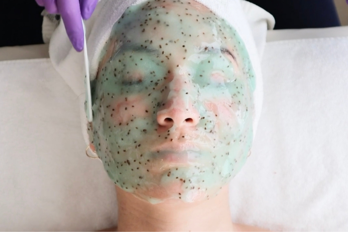 Woman in a Green and White Face Mask at Bella Sante