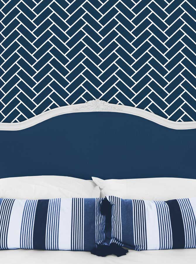 Bed Headboard With Pillows And Navy Chevron Wall Printed Backdrop