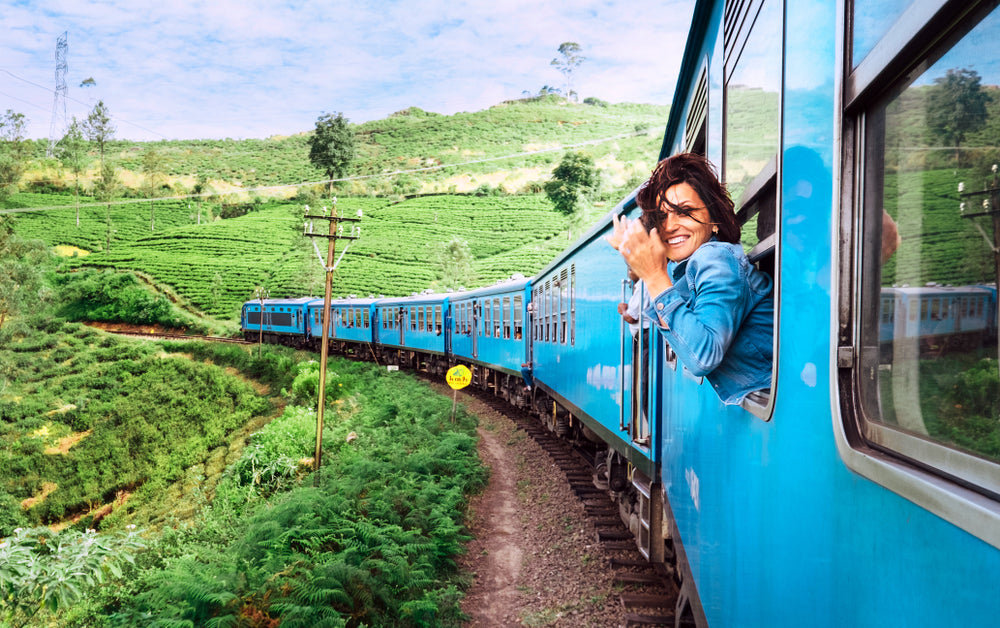 woman taking photo from train