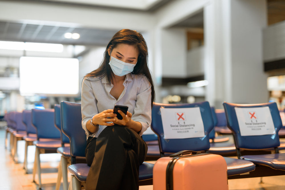 female traveller at airport during covid