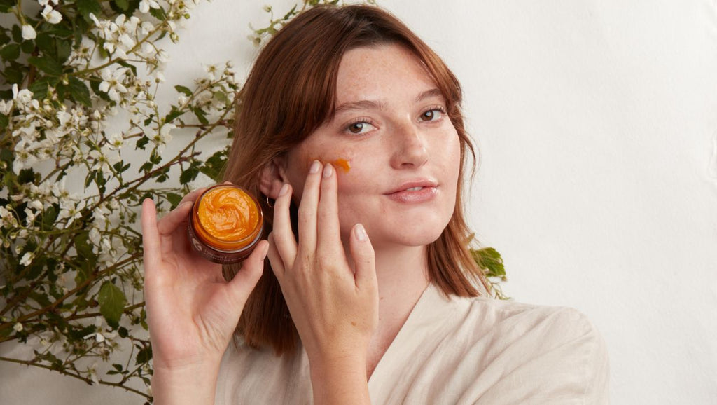 woman applying Vitamin C Regenerative Balm for brightening