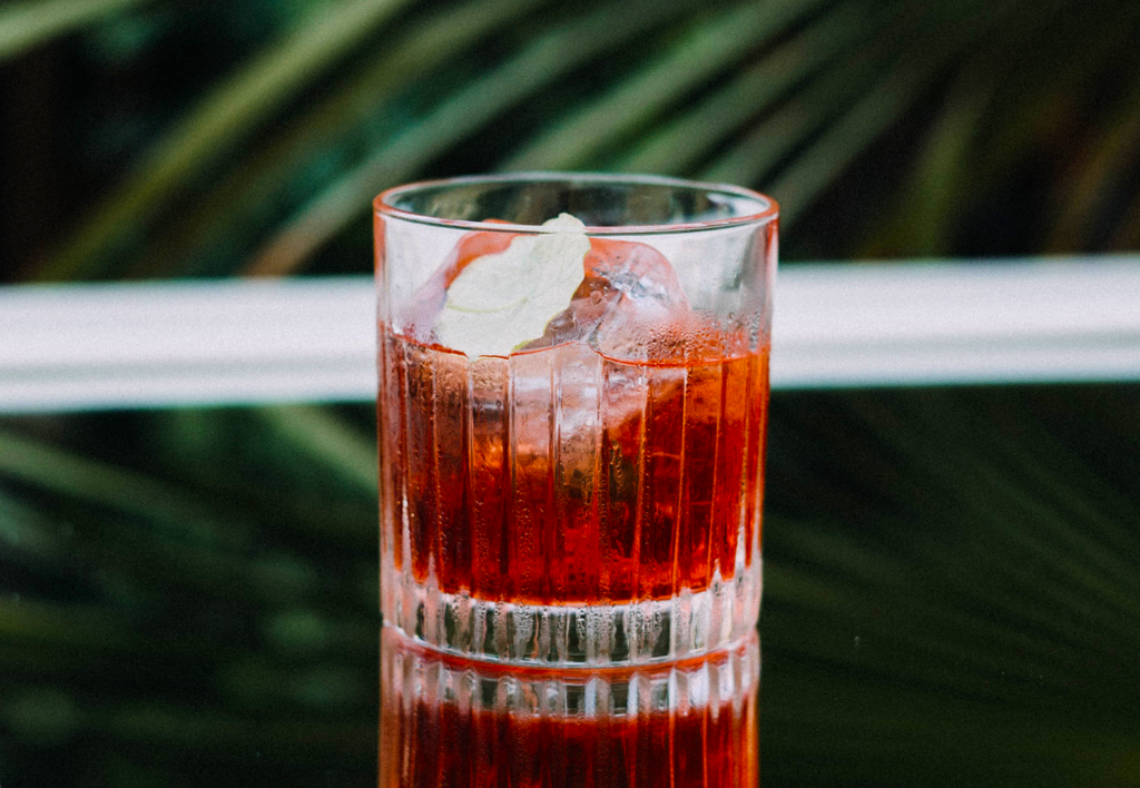 A cocktail containing alcohol on the countertop