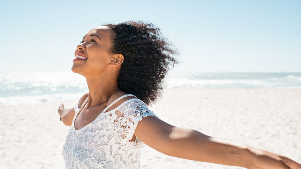 happy woman embracing her natural beauty