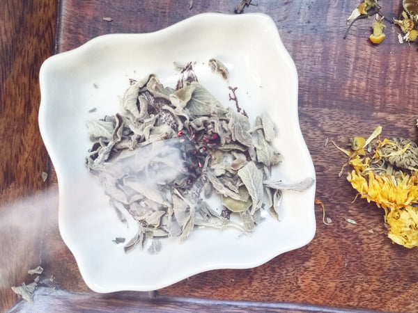 Sage smudging to cleanse room 