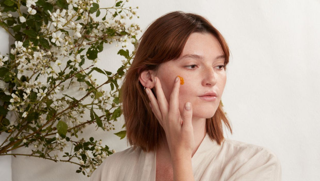 woman applying Apoterra vitamin c regenerative balm