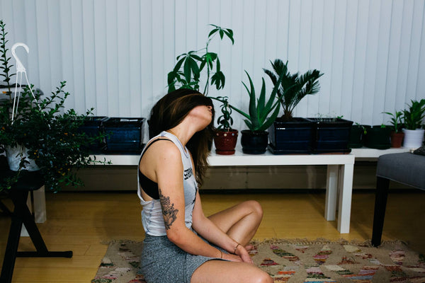 cool girl tilting head in meditation