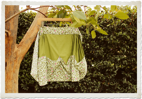 Vintage apron hanging from a tree
