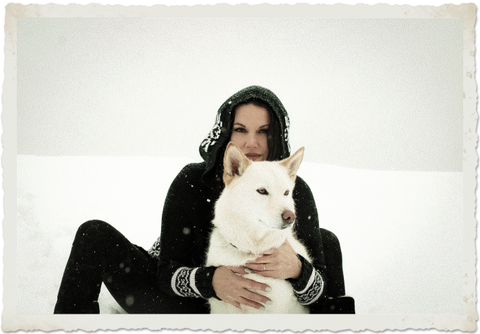 Woman and her husky in the snow