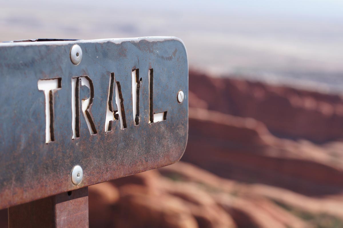 Trail sign on a desert trail.