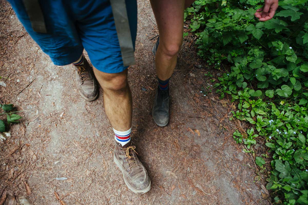 Couple wearing Cloudline socks on a hike.