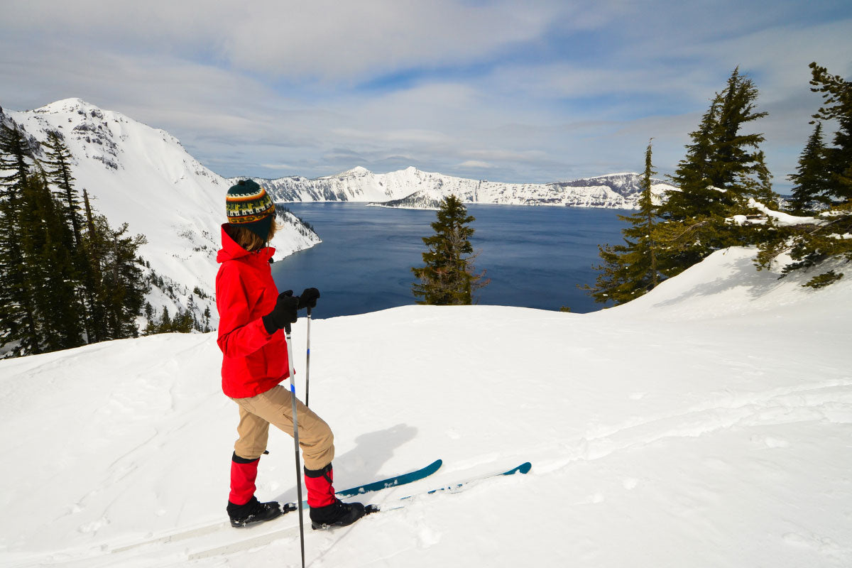 Women cross country skiing above Crater Lake.