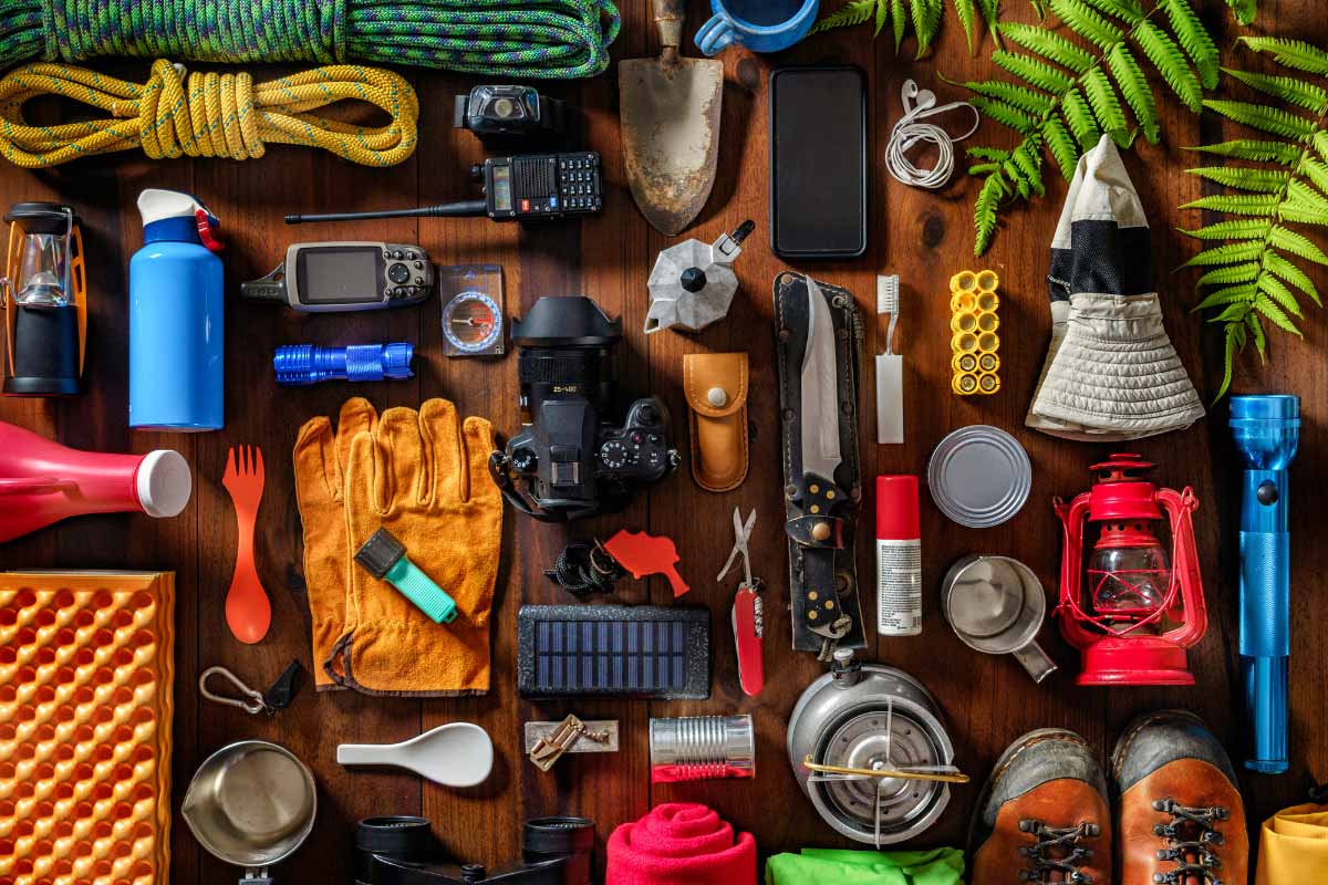 Hiking accessories and gear laid out neatly viewed form above.