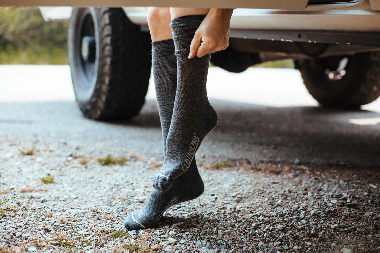 Women pulling on Clouldine compression socks