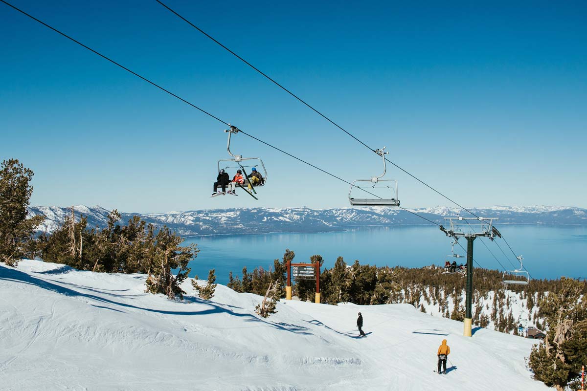 Skiers and Snowboarders above Lake Tahoe