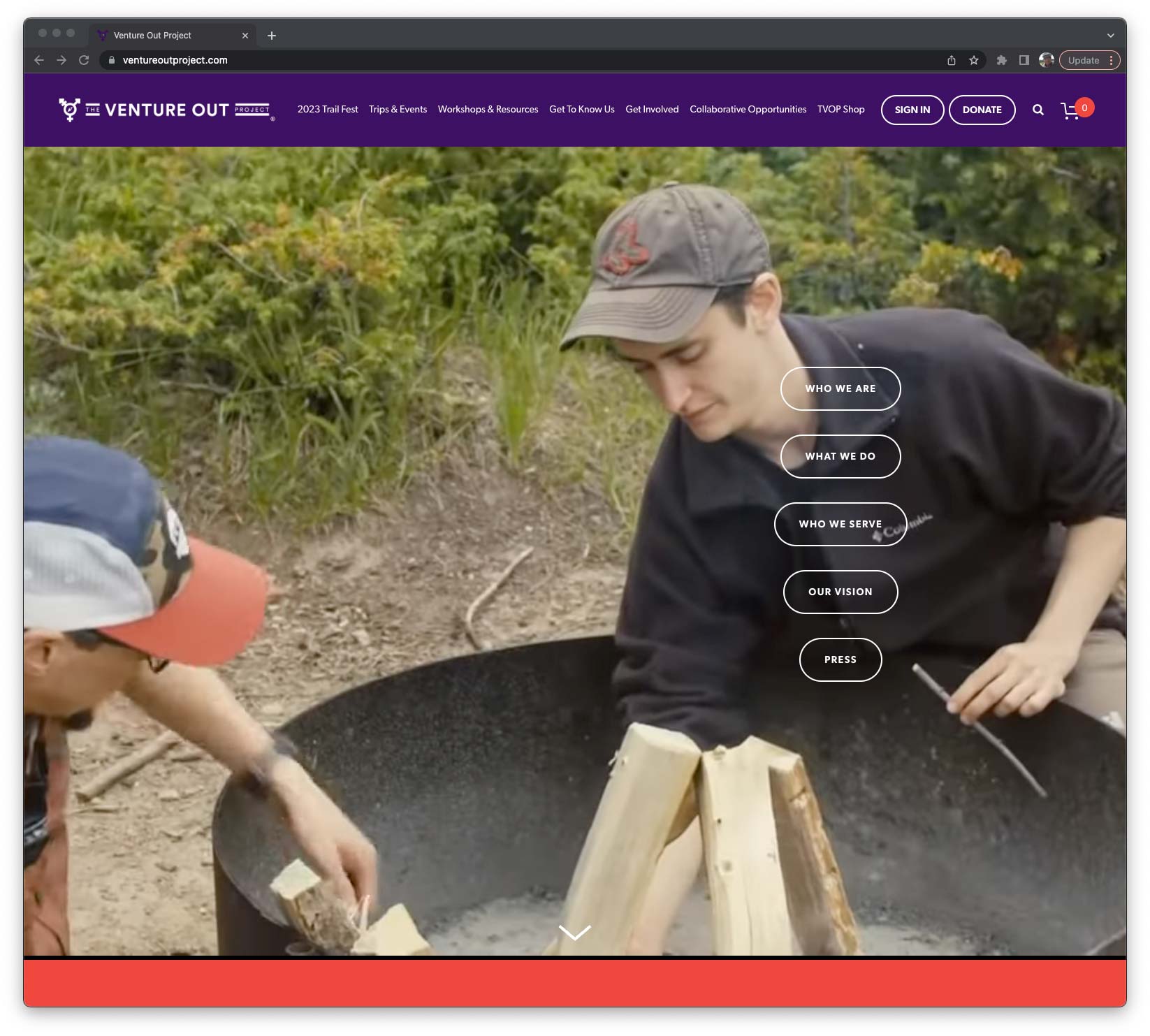 The Venture Out Project website homepage that shows two people building a fire in a campground fire pit.