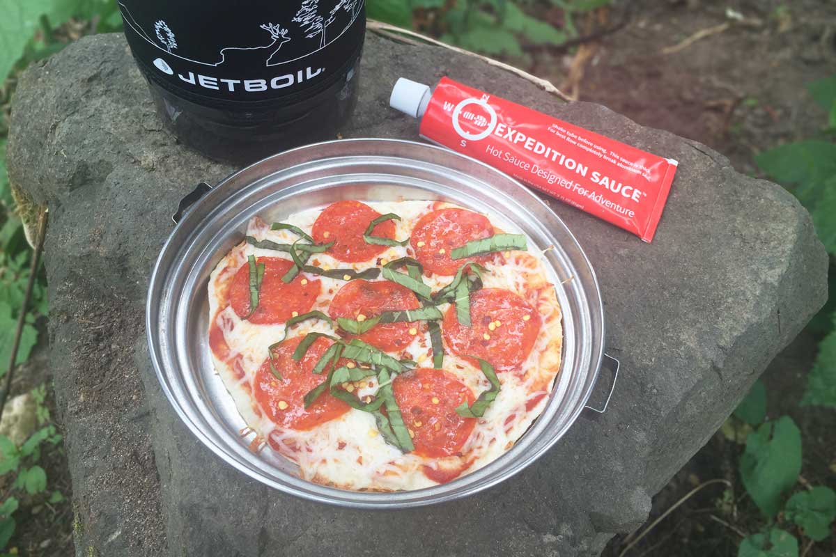 Tortilla trail pizza with pepperoni, basil, and expedition hot sauce.