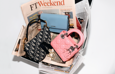 Dior oblique saddle bag, mini pink lady Dior, blue prada wallet on chain in recycled newspaper packaging