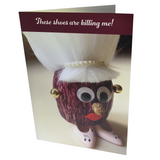 Greeting card with a whimsical eggplant character wearing shoes on the front.