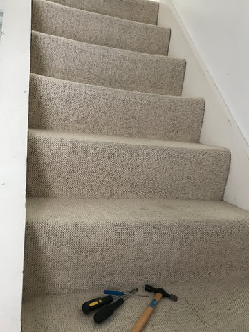 Old cream stair carpet 