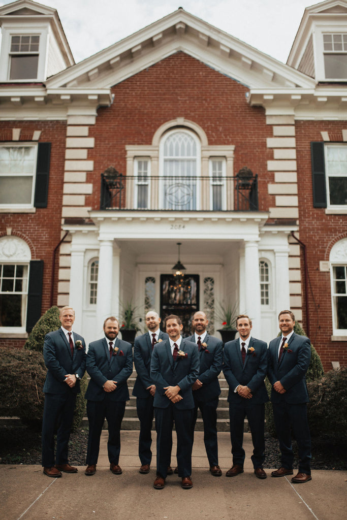 groomsmen in navy suits