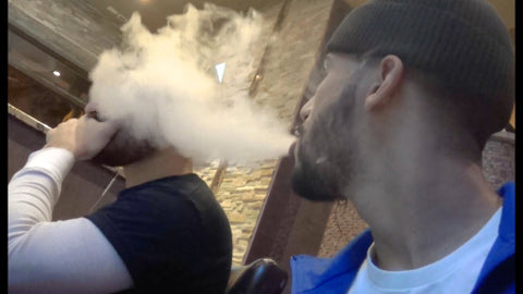 blowing vapor in someones face